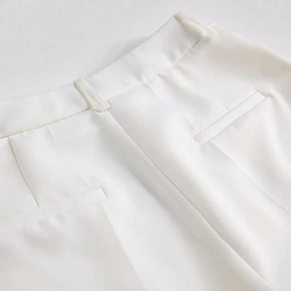 Elegant British designer women's suit set with beaded blazer and flare pants in white
