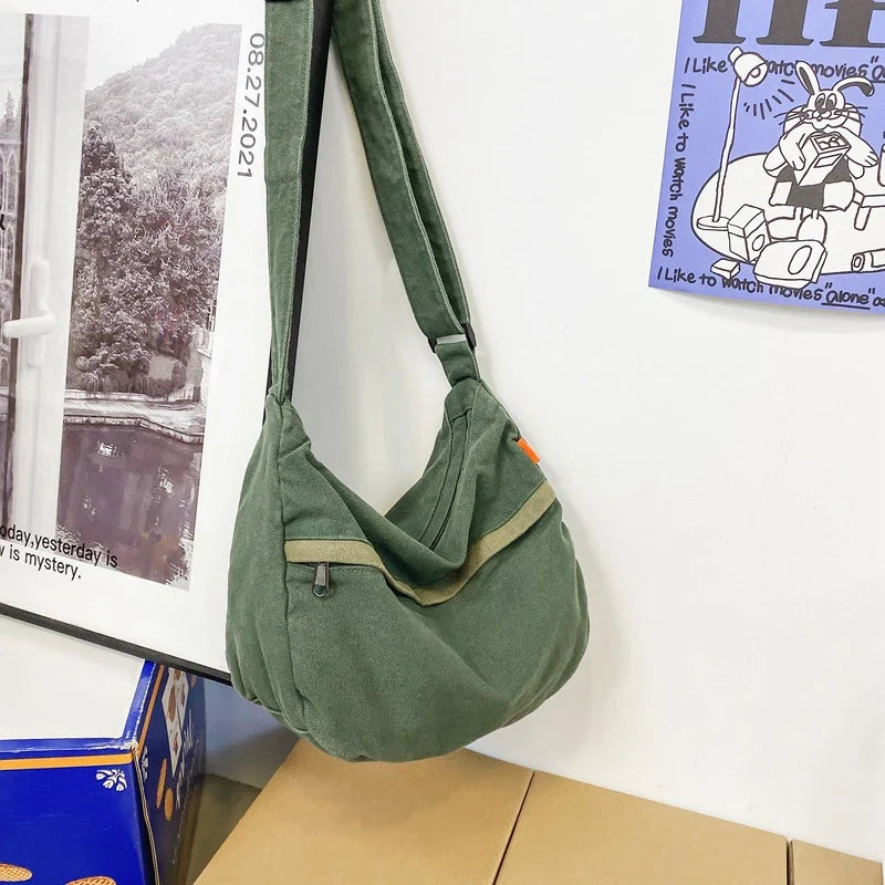 A stylish and durable canvas tote bag with a spacious interior and a timeless vintage-inspired design, perfect for everyday use and travel