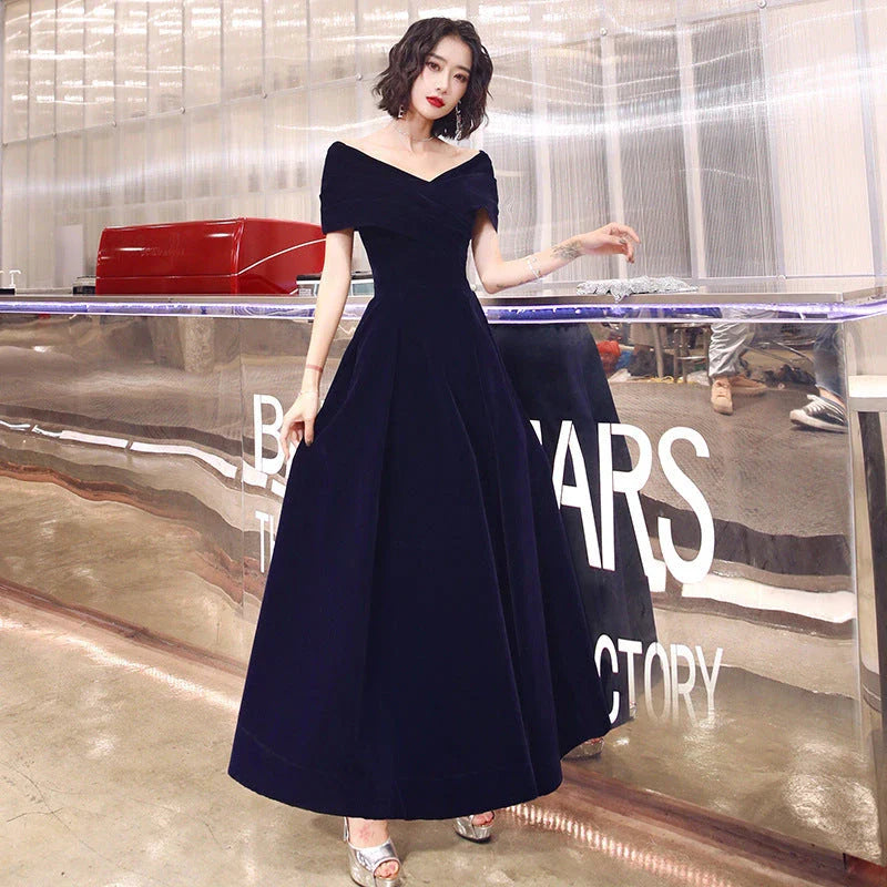 Off-shoulder wine red bridal dress with long, flowing skirt and tight waist for a sophisticated, elegant look