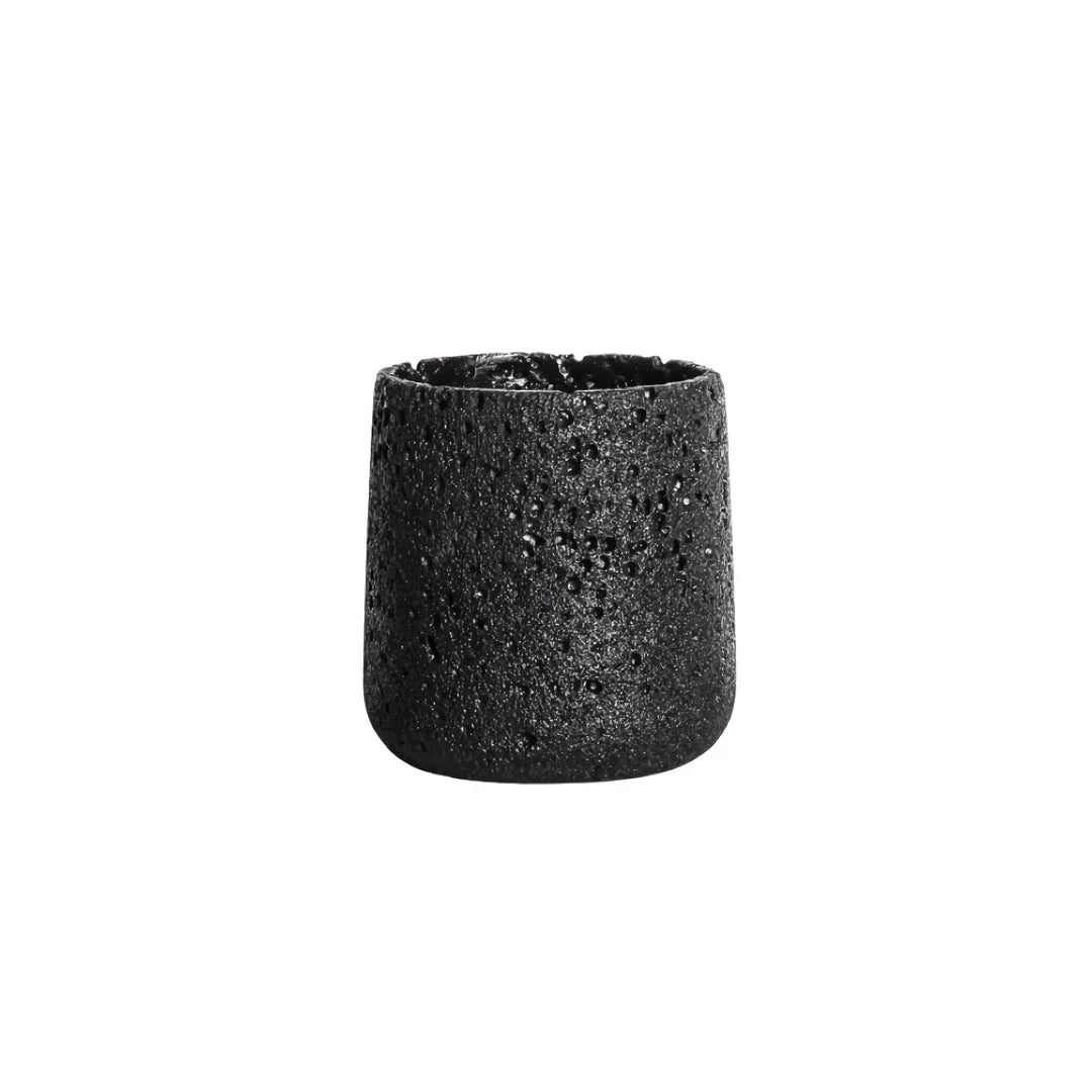A modern, perforated cement bonsai planter in a Nordic-inspired design, available in various sizes and colours.