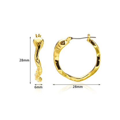 A pair of gold-toned stainless steel hoop earrings, showcasing a classic and sophisticated design