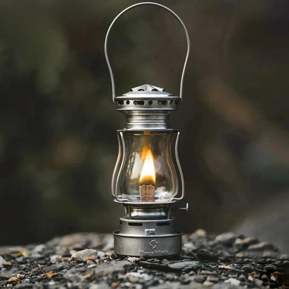 Classic vintage-inspired kerosene camping lamp with stainless steel construction and automatic ignition for reliable outdoor lighting