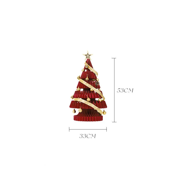 A beautifully crafted origami Christmas tree decoration in a Nordic-inspired style, with a warm, glowing illumination