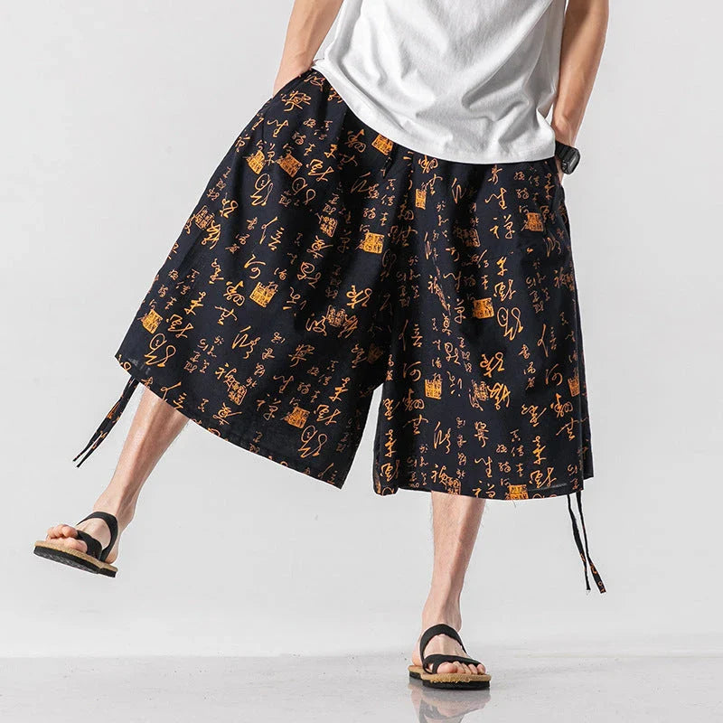 Men's loose-fitting Chinese-inspired cropped pants with a dragon or elephant floral pattern in navy blue, red, or coffee colours
