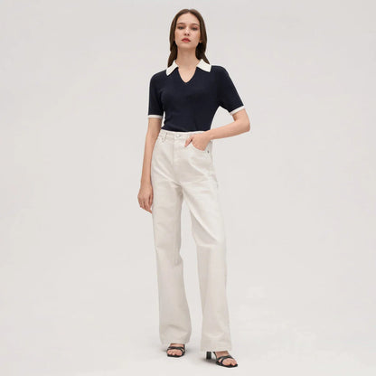 Stylish silk knit polo shirt in navy blue, featuring a slim fit design, contrasting trim, and a feminine v-neckline for refined British elegance.