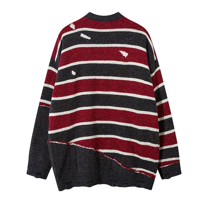 A cosy and stylish jumper featuring a patchwork design with contrasting stripes in a classic British colour palette.