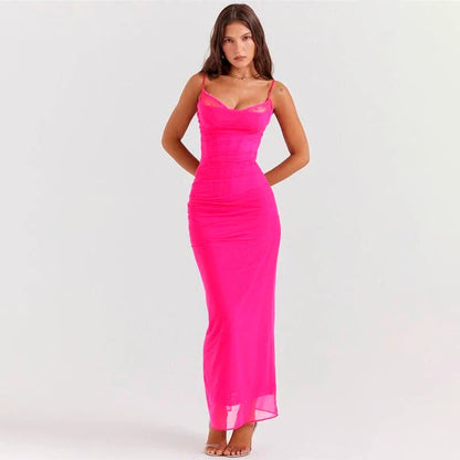 Elegant sleeveless maxi dress with a backless design and delicate spaghetti straps, ideal for autumn evenings and special events.