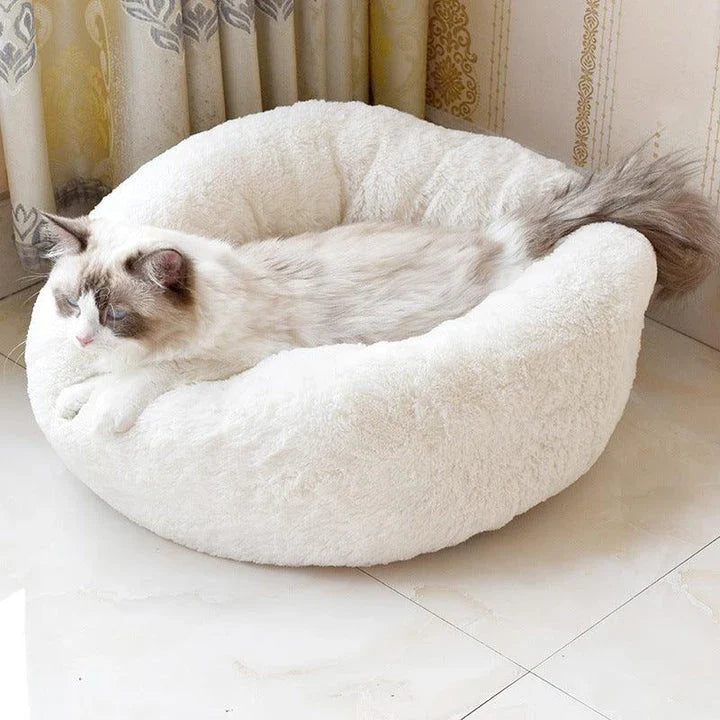 Cosy and comfortable fleece round cat bed in pink colour, perfect for your beloved feline friend to relax and unwind.