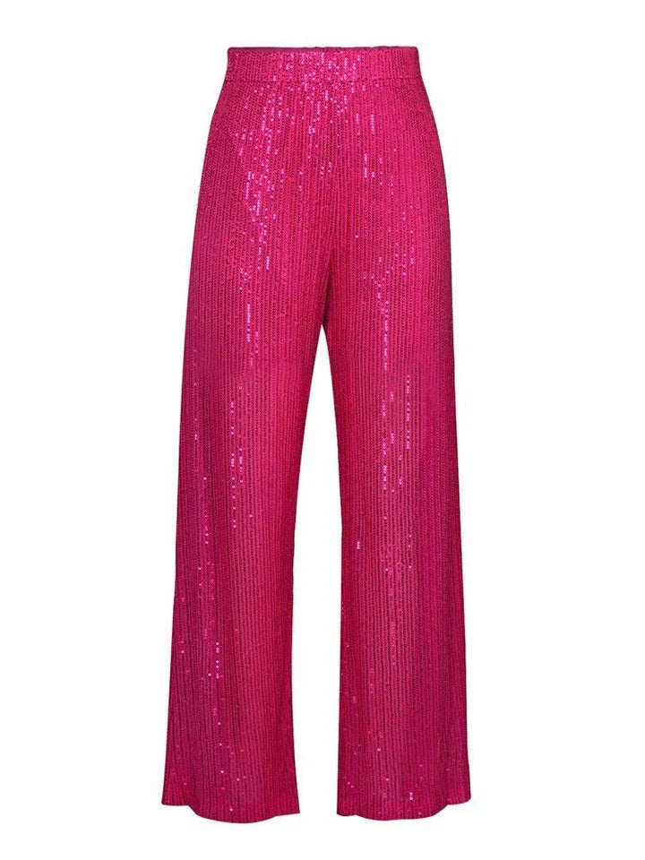 Elegant woman wearing a luxurious sequin top and pants set, perfect for a glamorous evening event