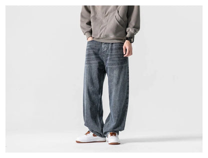 A pair of stylish retro-inspired Japanese jeans in black and grey, featuring a mid-rise waist and straight leg silhouette for a flattering, comfortable fit.