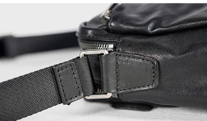 A premium British leather shoulder bag with a sleek, minimalist design and adjustable strap
