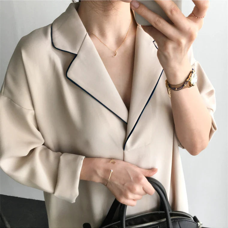 Premium Pleated Suit Dress in Timeless Beige featuring a V-neck, long sleeves, and a mid-length skirt with unique fold stitching detail