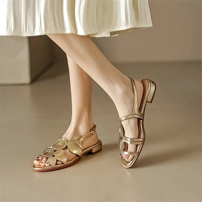 Chic sheepskin round toe sandals with chunky heel and stylish cutout design, perfect for the modern British woman
