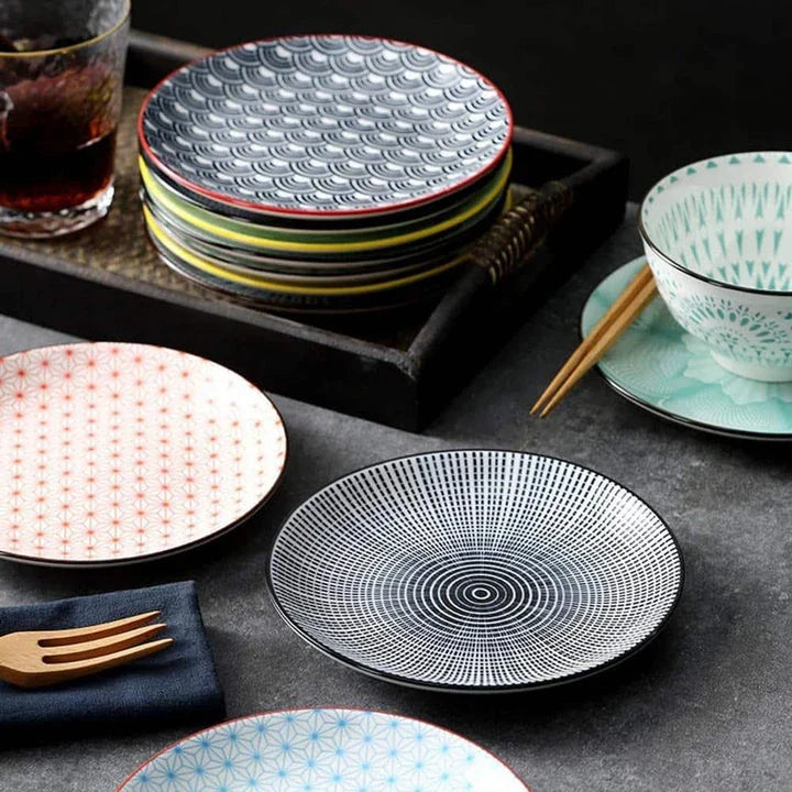 Elegant ceramic plates with vibrant, whimsical prints in a variety of enchanting designs