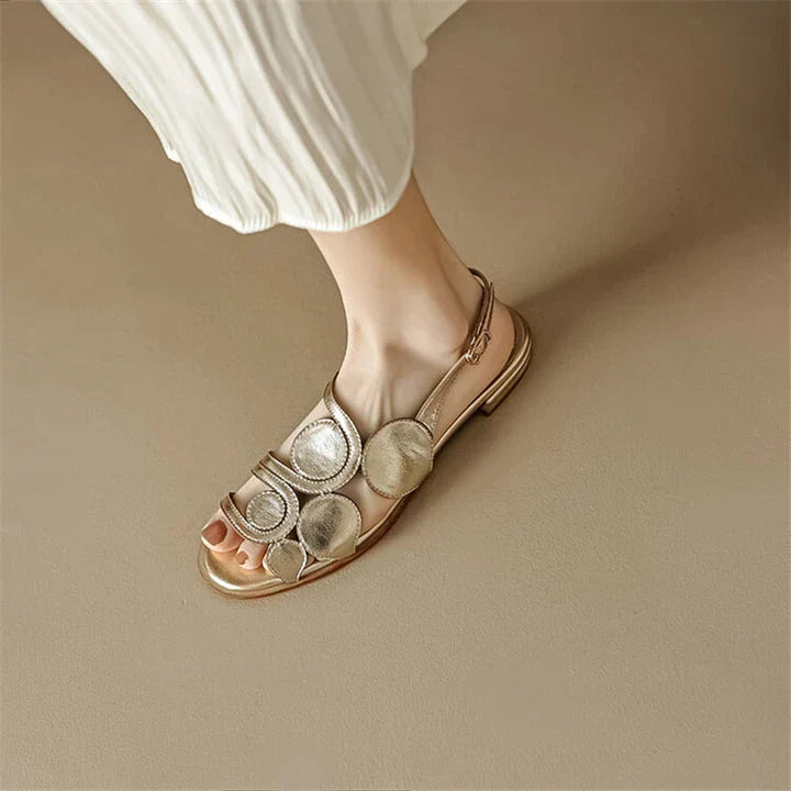Chic sheepskin round toe sandals with a chunky heel and hollow out design, featuring a secure back strap and a modern, versatile style