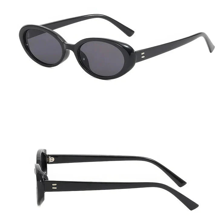 Oval-shaped women's sunglasses in a white and grey colour, offering UV protection and a stylish, retro-inspired design.