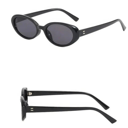 Oval-shaped women's sunglasses in a white and grey colour, offering UV protection and a stylish, retro-inspired design.