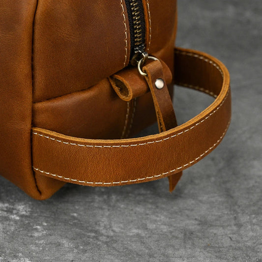Premium leather clutch bag with multiple interior pockets, designed for the sophisticated British gentleman
