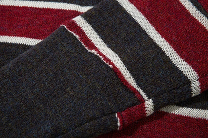 A cosy and stylish jumper featuring a patchwork design with contrasting stripes in a classic British colour palette.