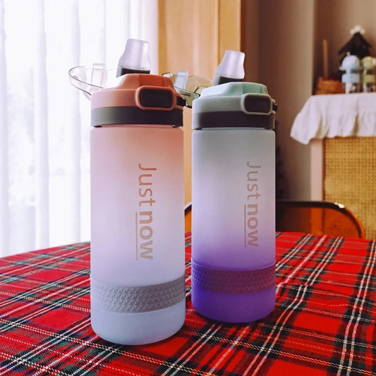 Eco-Friendly Portable Water Bottle with Straw in various colours, including Purple, Yellow, and Blue