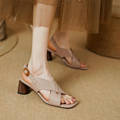 Elegant leather high heel sandals for women, featuring a refined square heel, stylish buckle strap, and sleek design for a sophisticated look.
