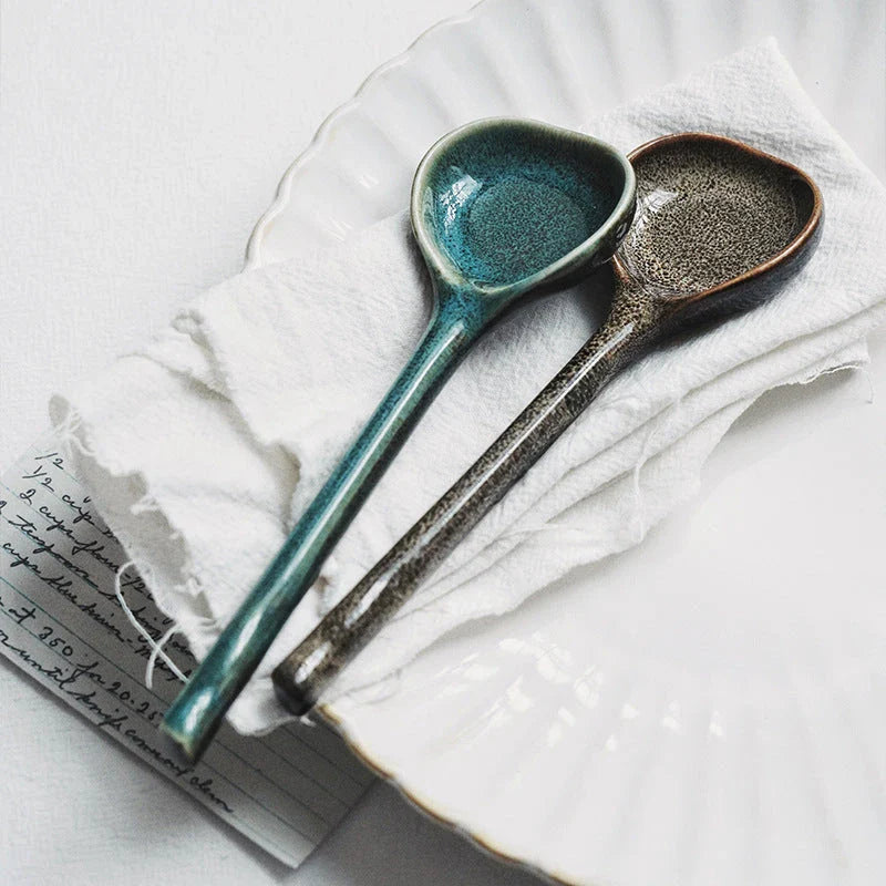 Elegant ceramic soup spoon with long handle and vibrant grey glaze, perfect for refined dining experiences