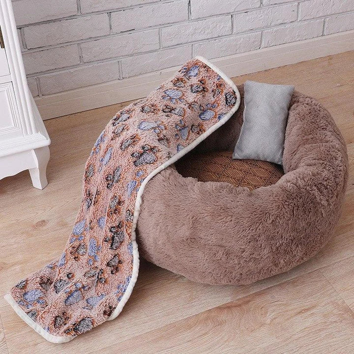 Cosy and comfortable fleece round cat bed in pink colour, perfect for your beloved feline friend to relax and unwind.