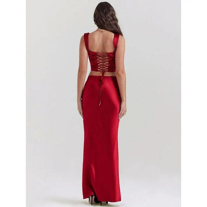 Elegant satin two-piece skirt set featuring a backless crop top and ankle-length skirt in a rich wine colour