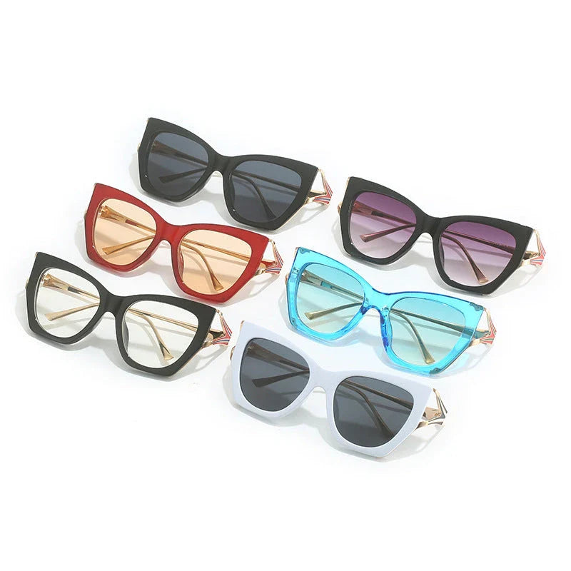 Refined cat eye sunglasses with blue gradient lenses and sleek metal frames, offering timeless British style and UV400 protection.