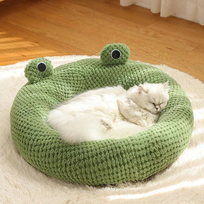 Cosy frog-shaped pet bed made of plush bubble velvet material, providing warmth and comfort for small cats and dogs