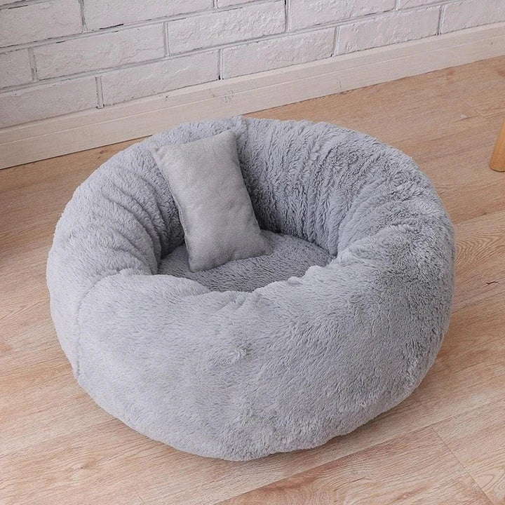 Cosy and comfortable fleece round cat bed in pink colour, perfect for your beloved feline friend to relax and unwind.