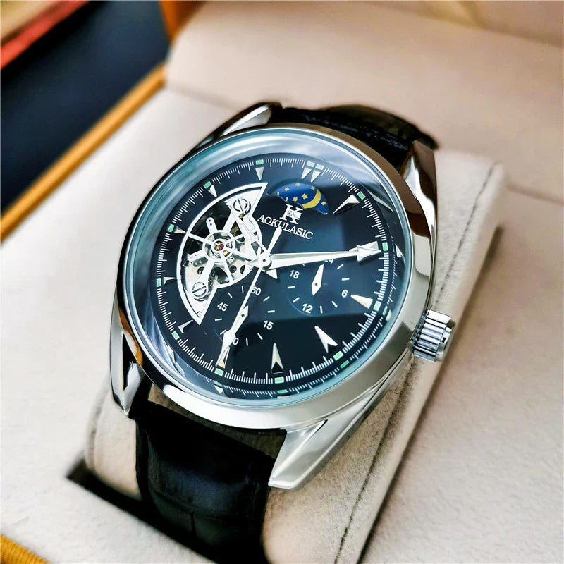 Elegant men's automatic mechanical watch with exquisite hollowed-out design, featuring luminous hands, moon phase display, and small seconds subdial.