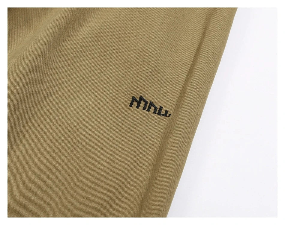 Sophisticated men's casual trousers in various colours, featuring a tailored straight-leg design and mid-rise waistline for a polished, British-inspired look.
