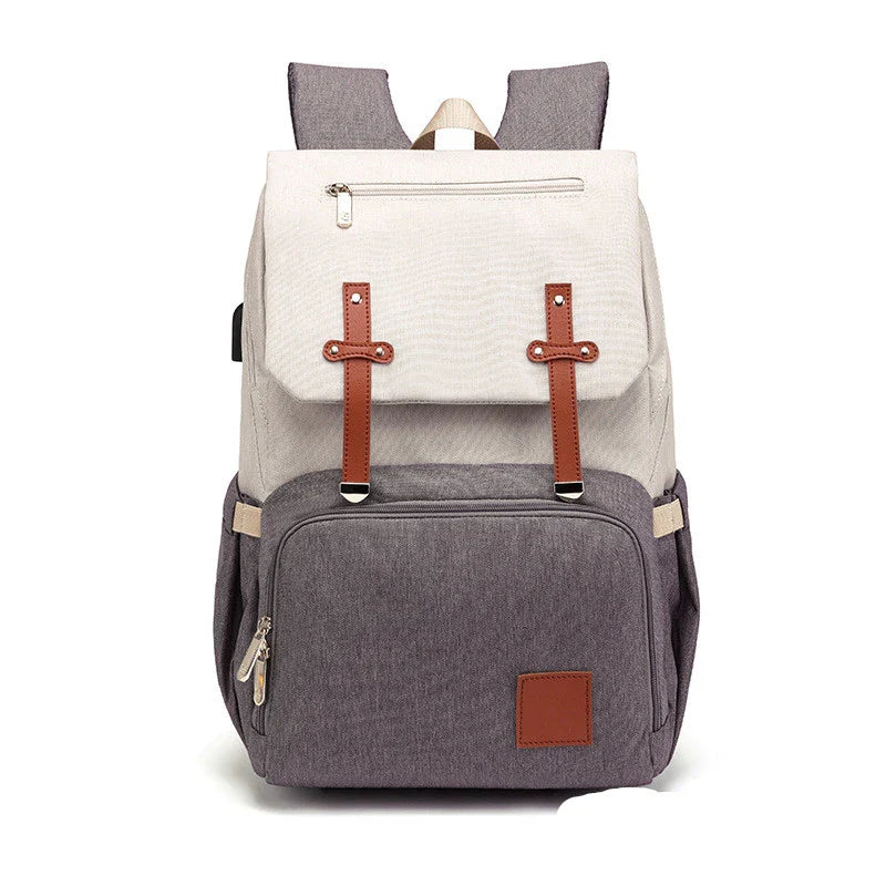 A stylish and practical mummy backpack with multiple pockets, perfect for organising and transporting all your parenting essentials.