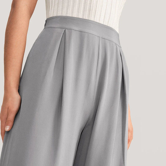Exquisite grey silk wide-leg trousers with high-waisted design and relaxed fit for sophisticated style