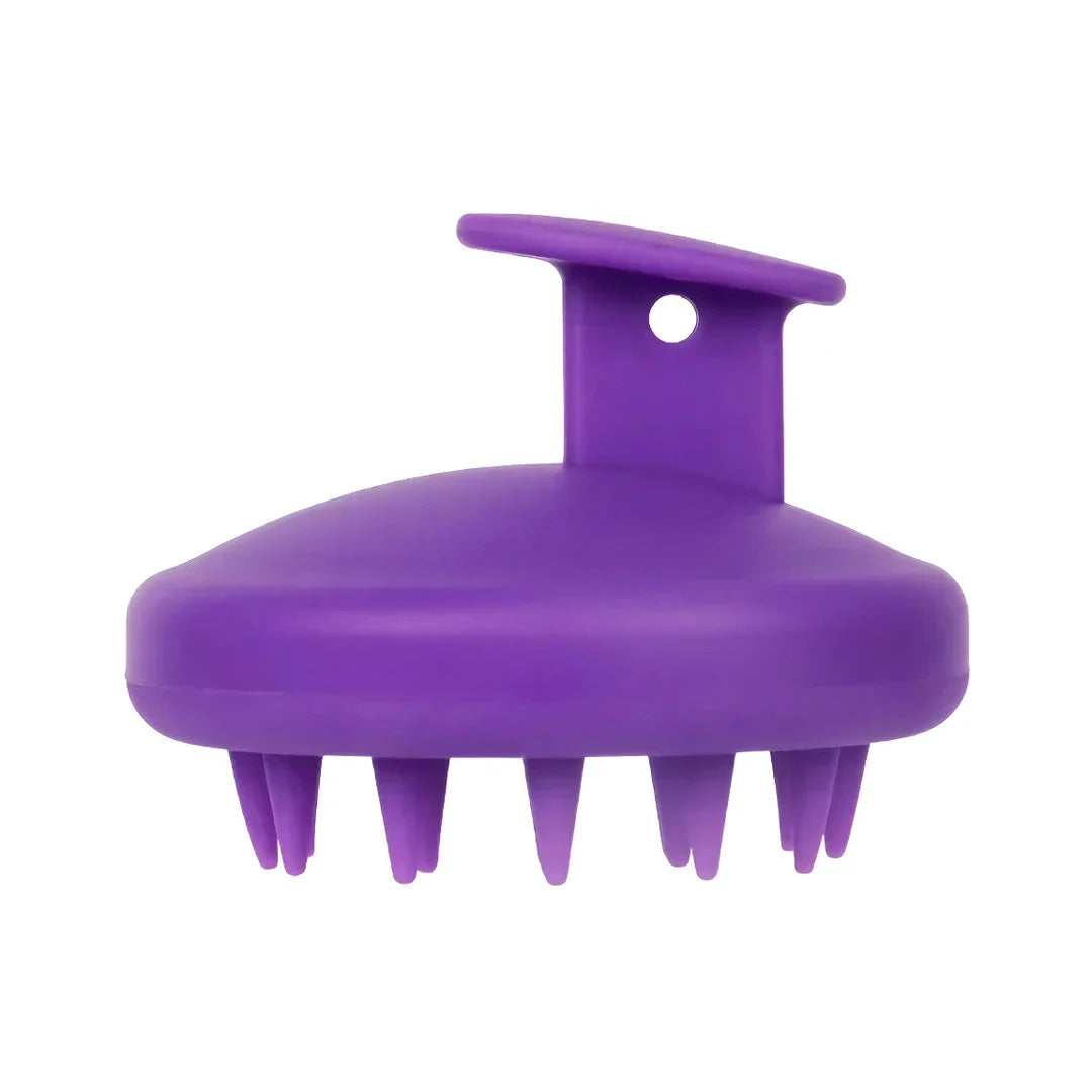 A green silicone scalp massager with soft bristles, designed to provide a soothing hair washing experience and promote healthy hair growth.
