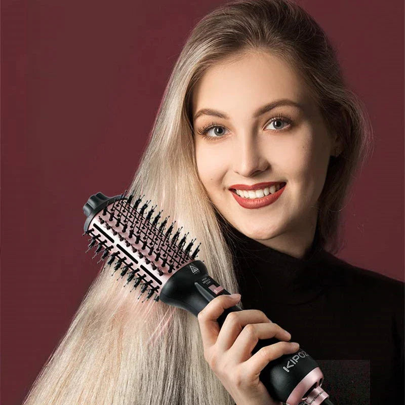 4-in-1 hot air styling brush with oval brush design for creating voluminous curls and reducing frizz