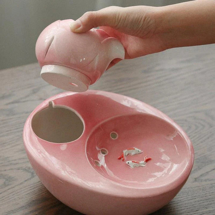 Elegant British-inspired ceramic drinking fountain with adjustable water flow and soothing ambiance