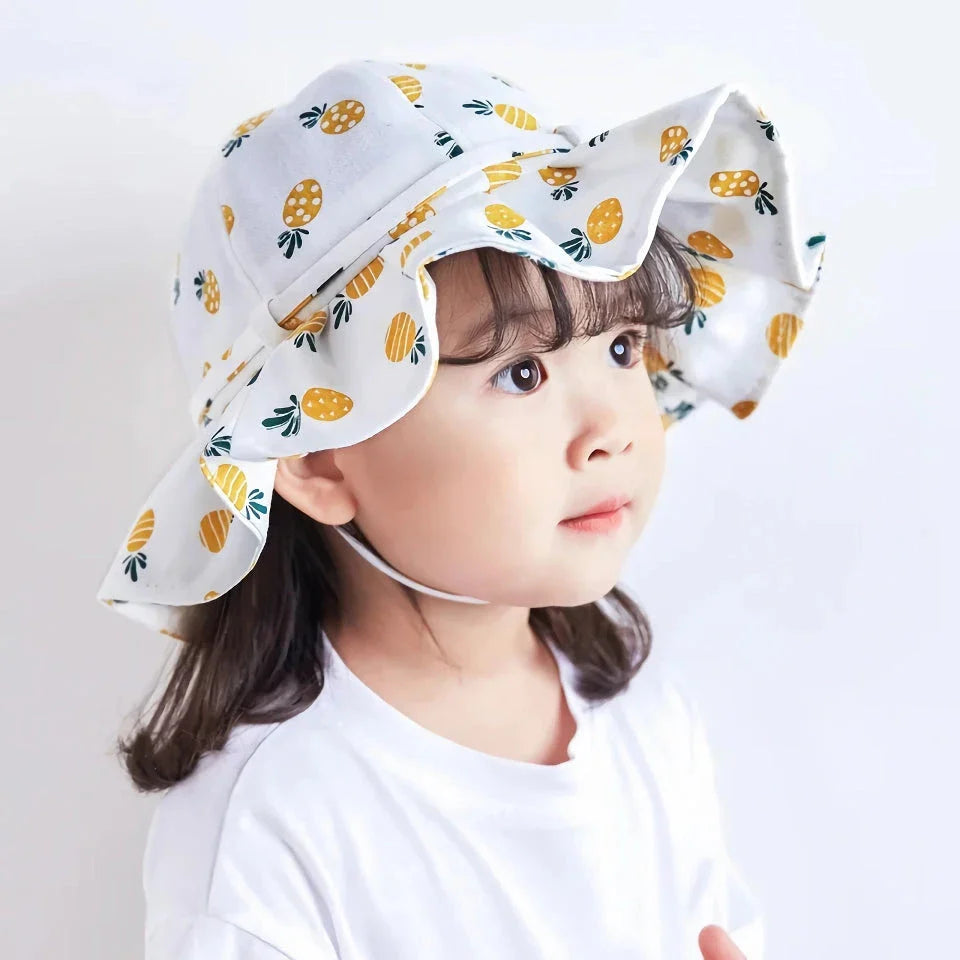 Adjustable white cotton sun protection bucket hat with cartoon pattern for children