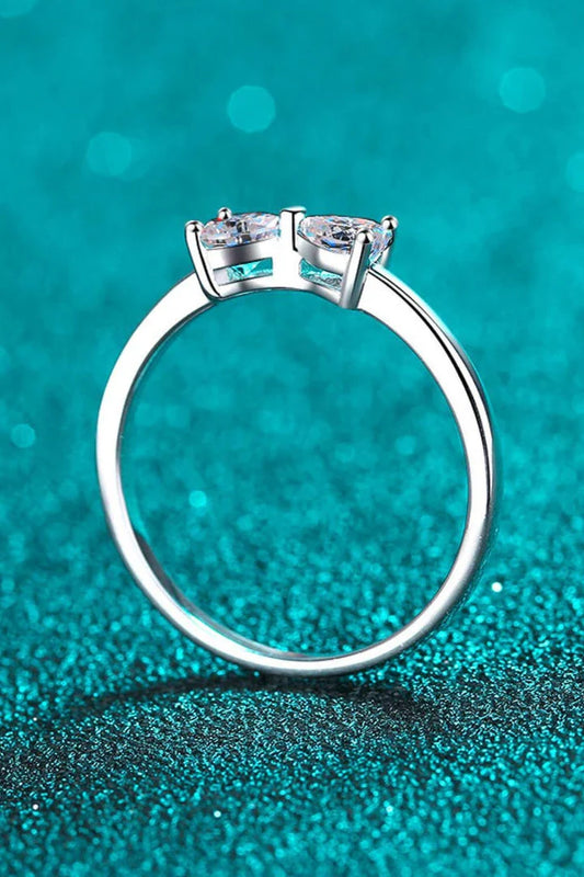 Elegant moissanite and sterling silver bow ring with a radiant, polished finish