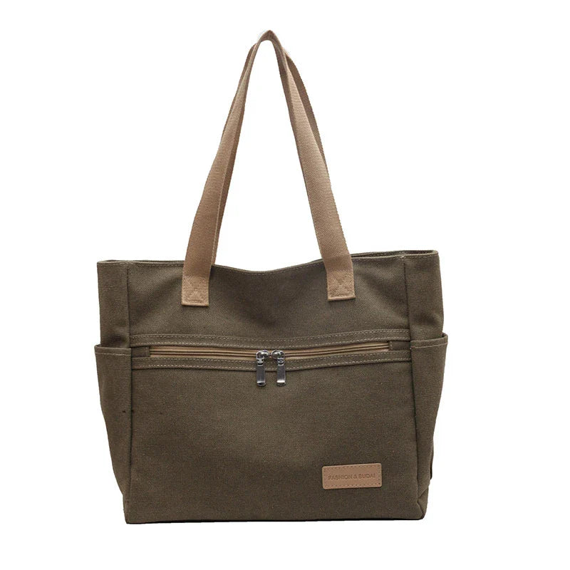 Premium canvas shoulder bag in grey, khaki, and green colours, featuring a stylish and functional design for everyday use.