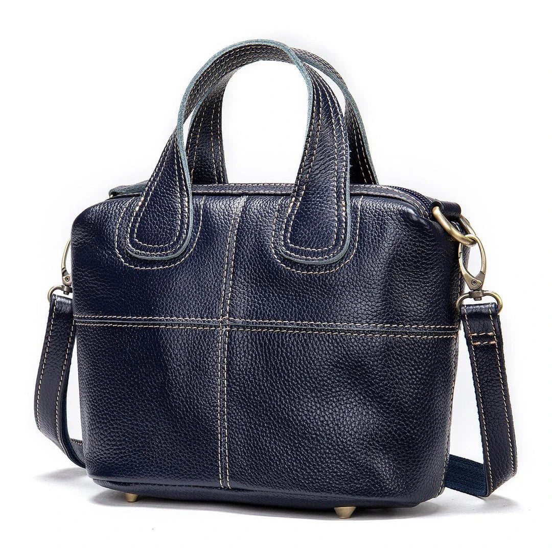 Premium leather shoulder bag for women in red, blue, and black colours with spacious interior and comfortable strap