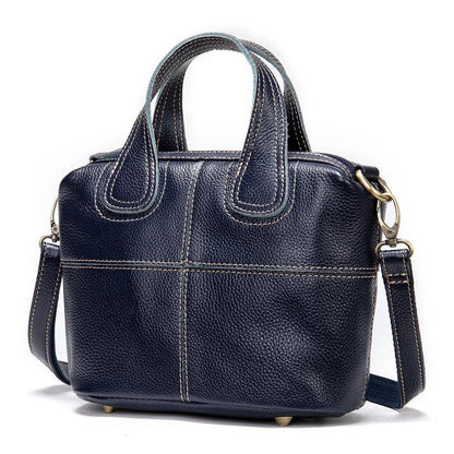 Premium leather shoulder bag for women in red, blue, and black colours with spacious interior and comfortable strap