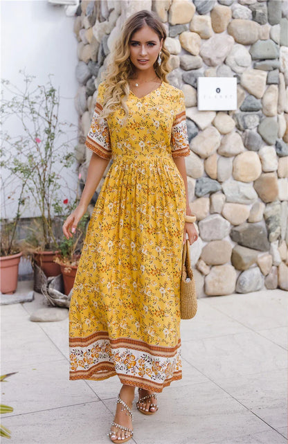 Elegant long dress with floral print design, perfect for coastal-inspired fashion