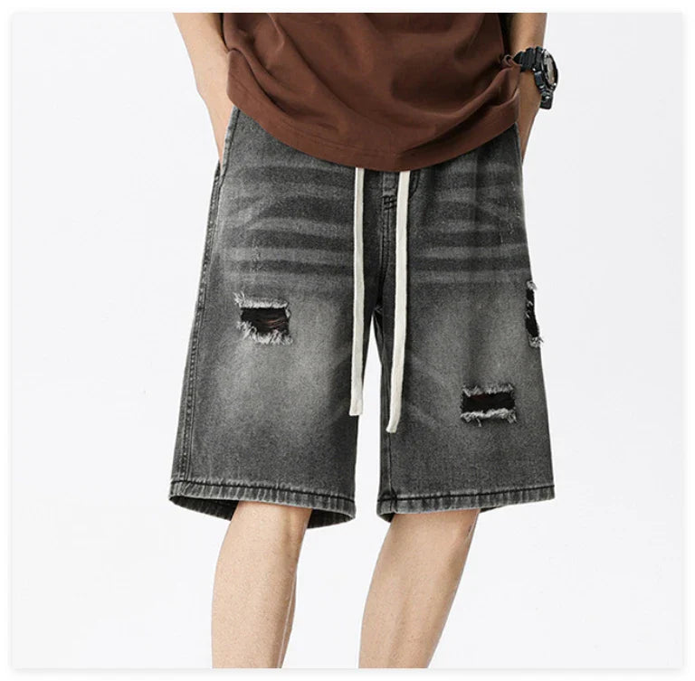 Premium British-crafted vintage-inspired ripped denim shorts for men with a straight-leg silhouette and authentic distressed details