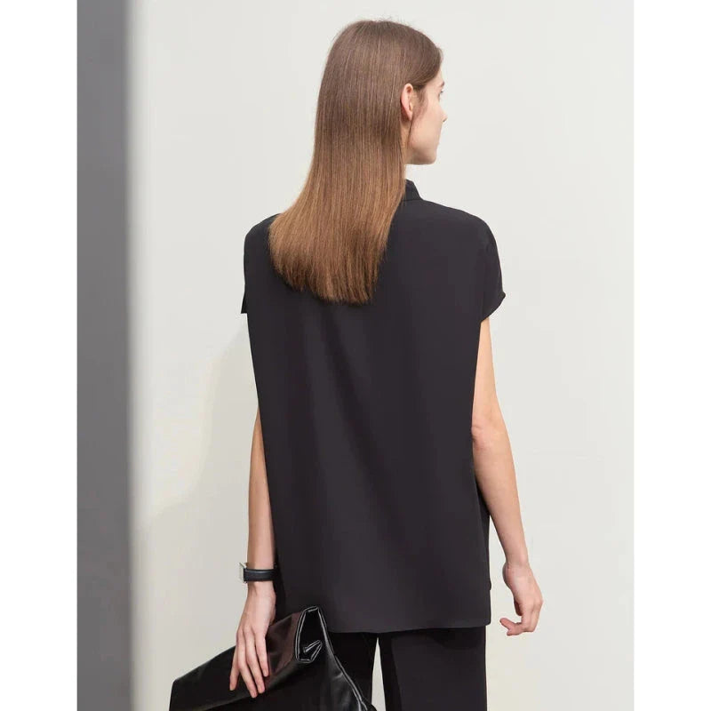 Elegant minimalist women's summer blouse in blue chiffon fabric with tie sleeves and hollow-out decoration