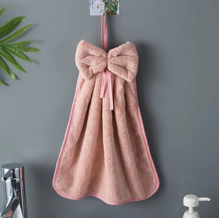 Elegant coral fleece hand towels with a unique bow design, perfect for kitchen and bathroom use