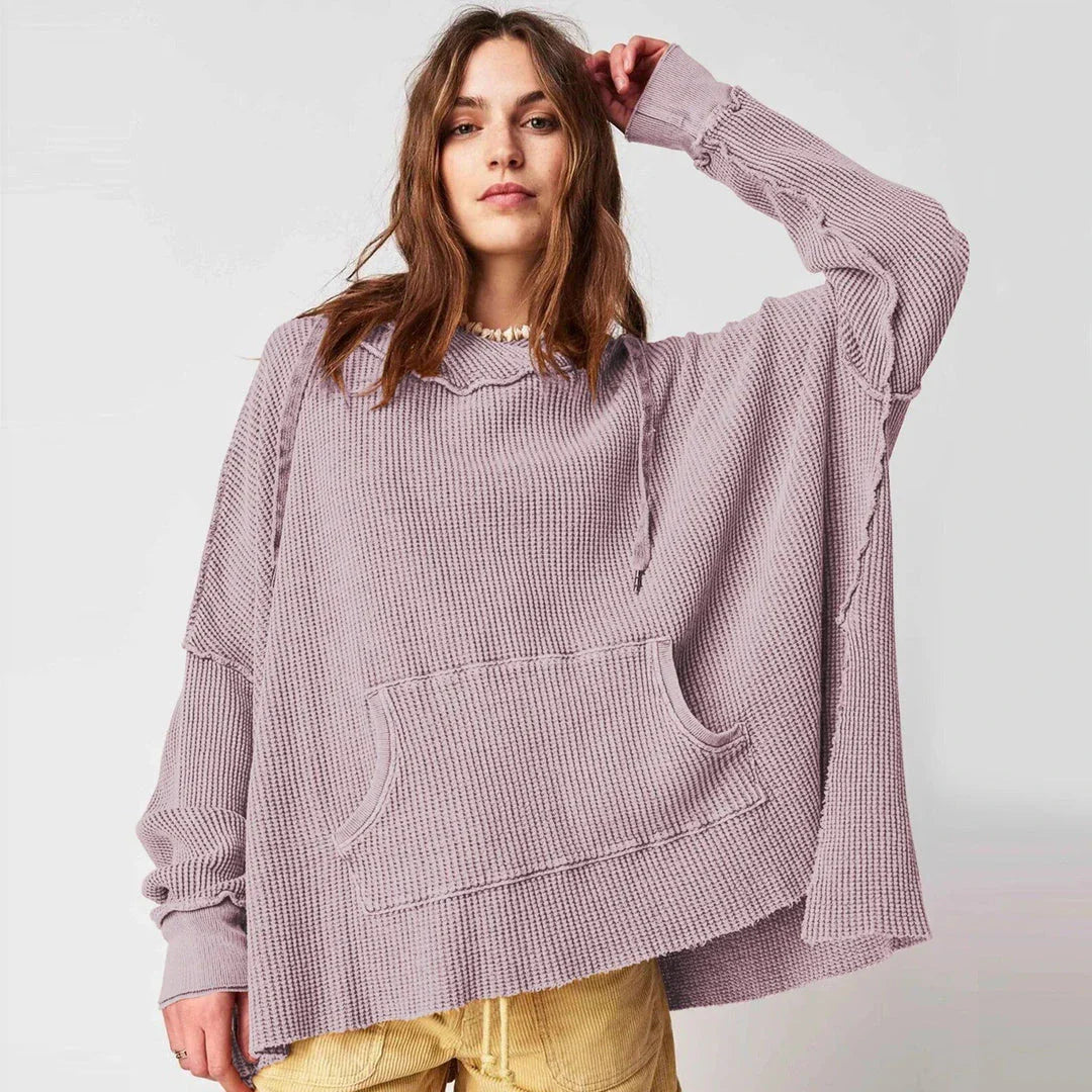 Cosy and stylish oversized hoodie with practical pockets for women, available in black, charcoal grey, and navy blue