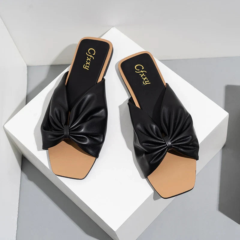Stylish bow-accented flat sandals for women in multiple colours