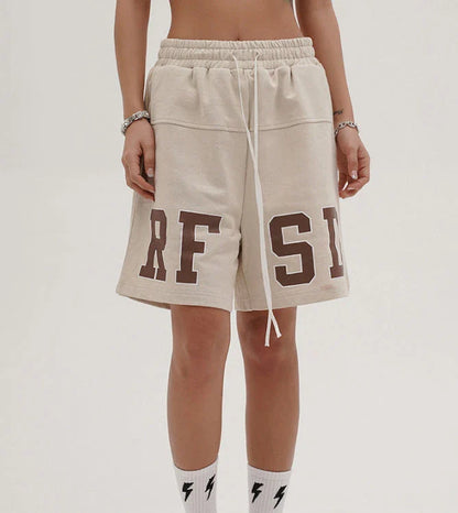 Premium loose-fit sports shorts with eye-catching printed patterns in black, khaki, and dark grey colours